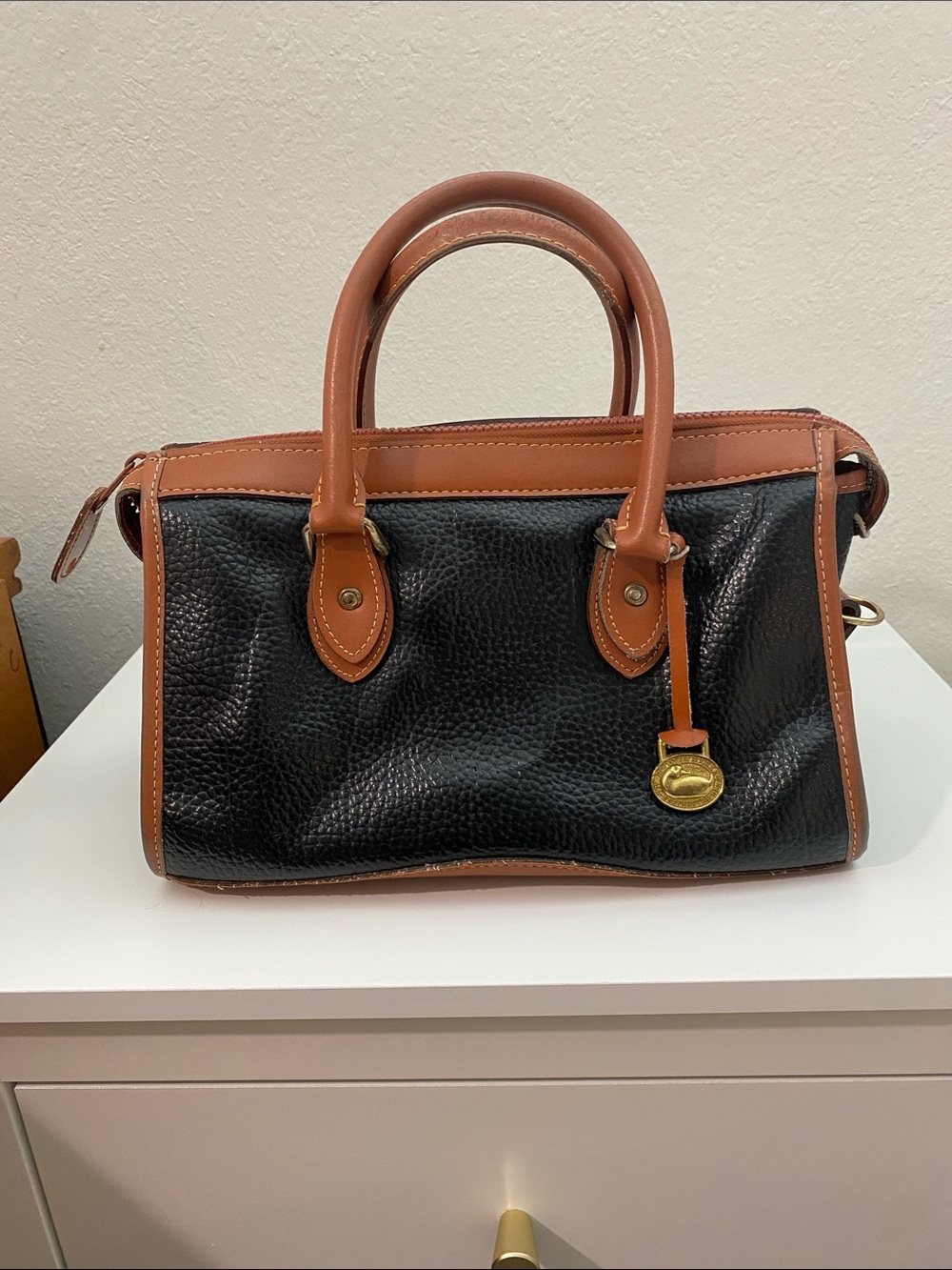 Dooney and Bourke All-Weather Leather Black and Tan Structured Satchel Handbag